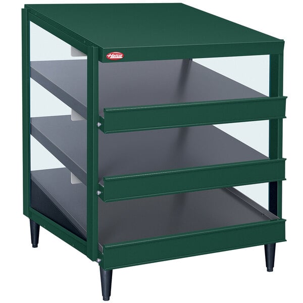 A green metal Hatco countertop shelf with glass shelves.