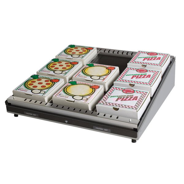 A Hatco Granite White pizza warmer shelf with pizza boxes stacked on it.