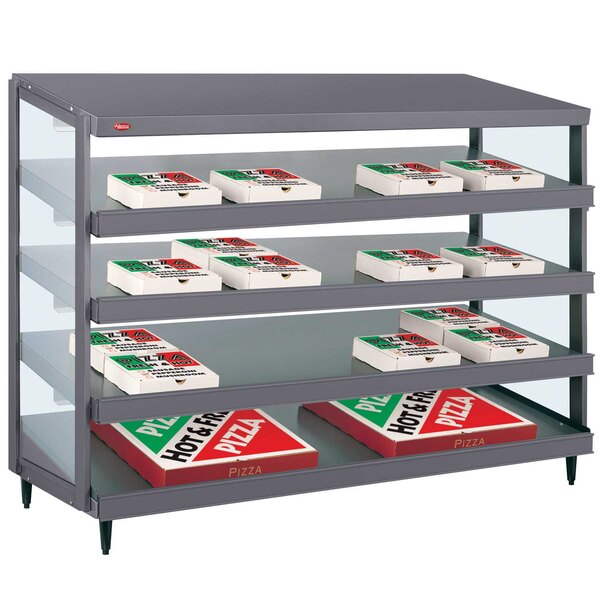 A Hatco Granite Gray Glo-Ray countertop warmer with pizza boxes on a shelf.