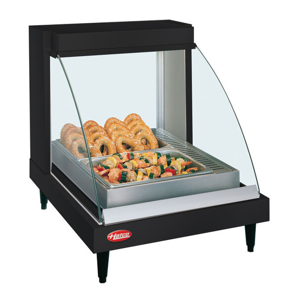 A Hatco countertop food display case with food inside.