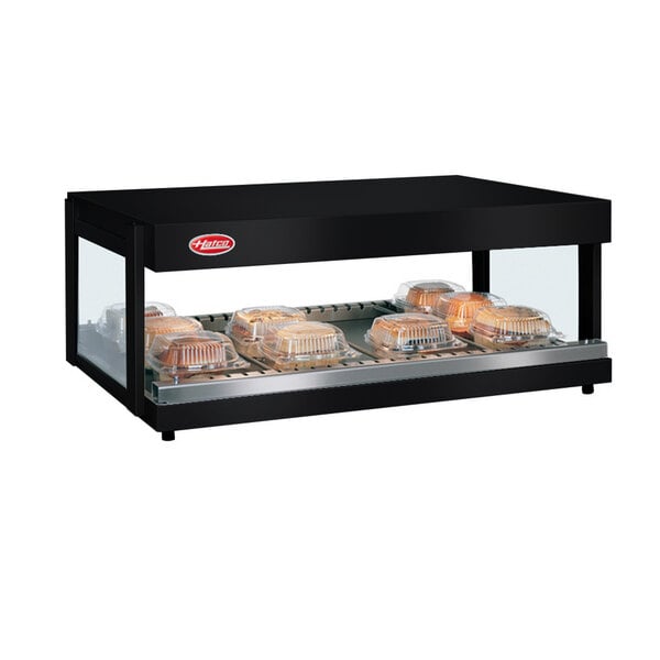 A black Hatco countertop food warmer with trays of food inside.