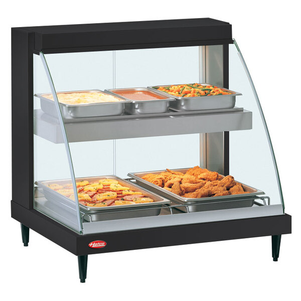 A Hatco Glo-Ray double shelf countertop hot food display case with food in it.