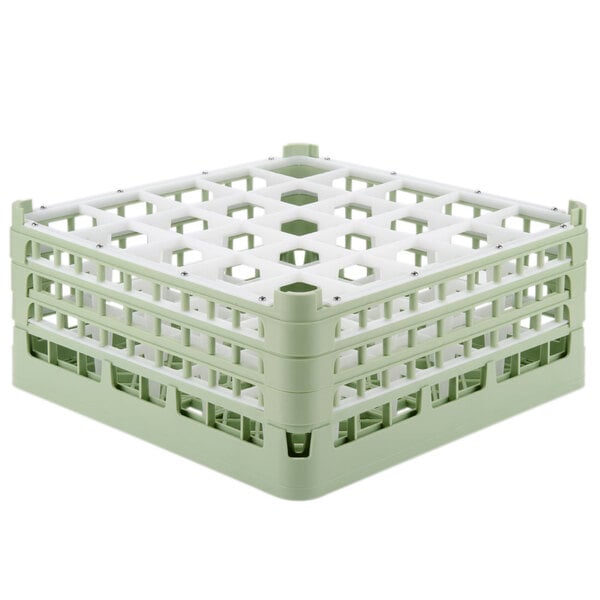 A light green plastic Vollrath glass rack with 25 compartments.