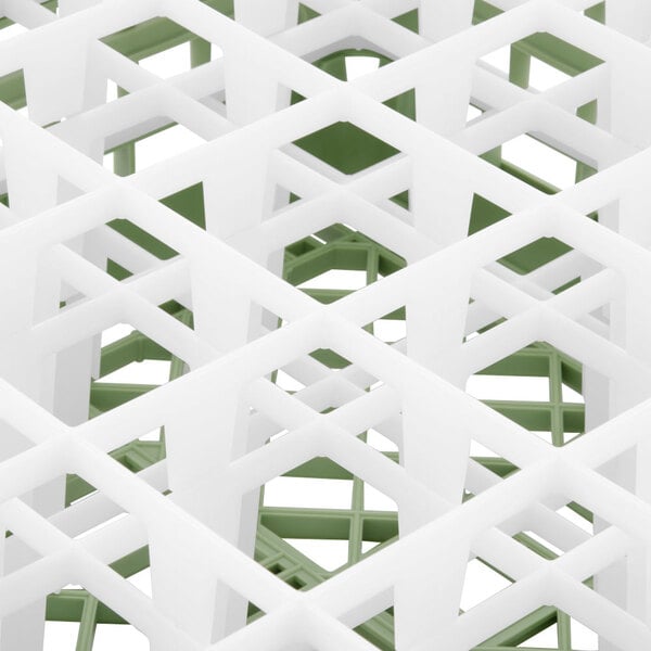 A white and green Vollrath Signature glass rack with 25 compartments.