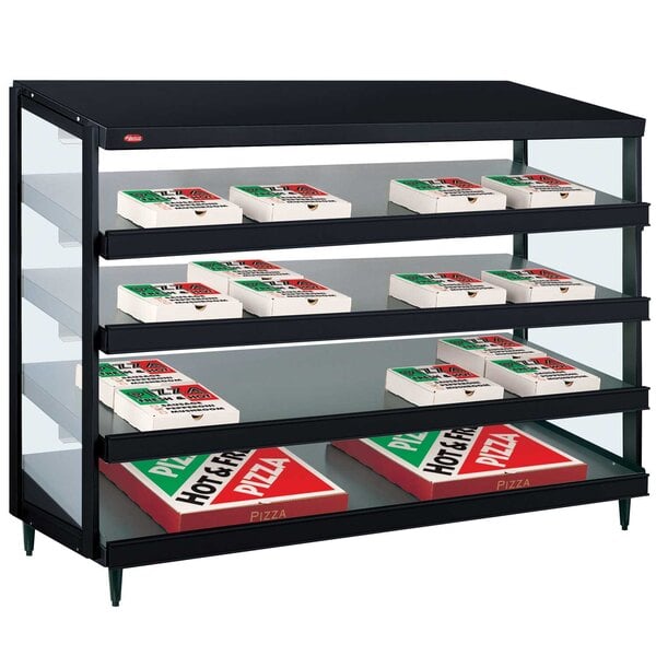 A black display case with boxes of pizza on it.