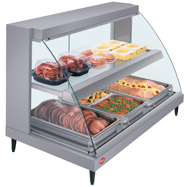 A Hatco Glo-Ray countertop display case with food on it.