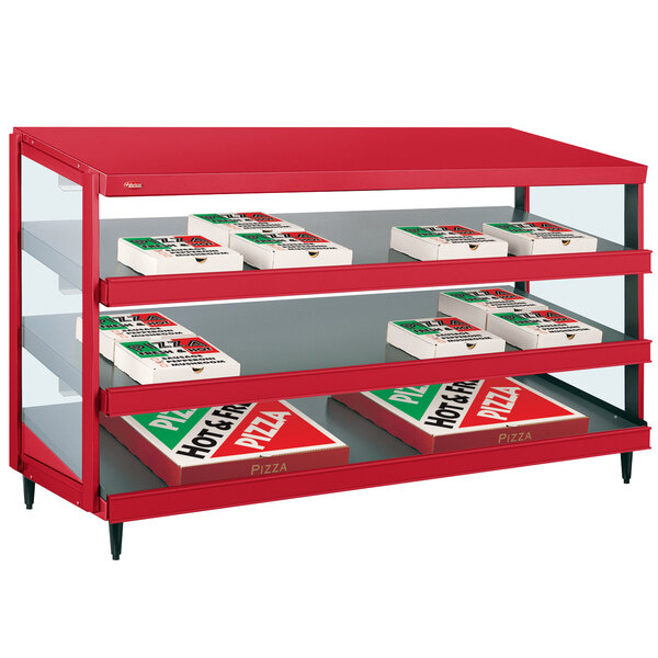 A red Hatco countertop display case with pizza boxes on shelves.