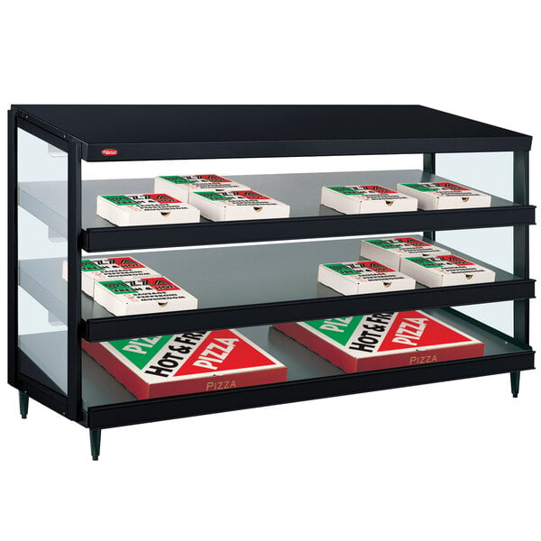 A black Hatco countertop pizza warmer shelf with pizza boxes inside.