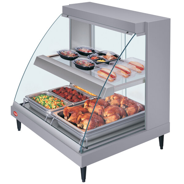 A Hatco Gray Glo-Ray countertop food display case with shelves of food inside.