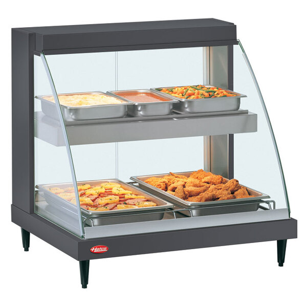 A Hatco Glo-Ray double shelf merchandiser with food on display.