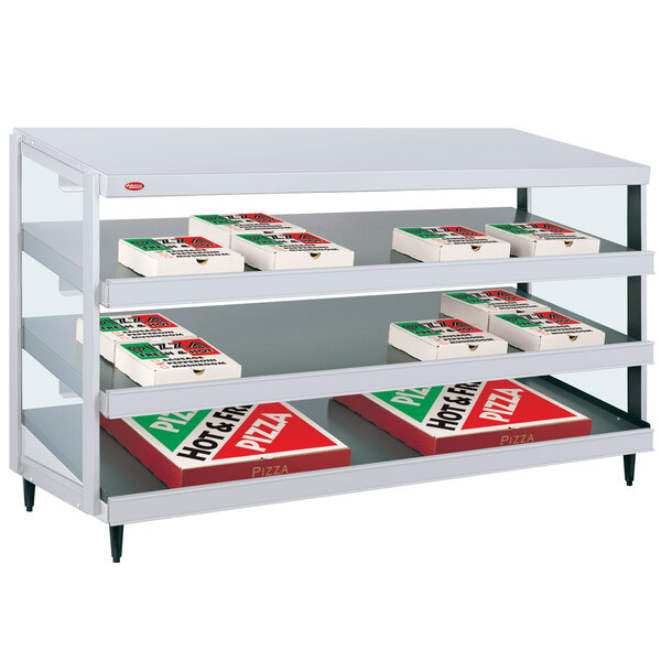 A shelf with red and white pizza boxes holding pizza on display.