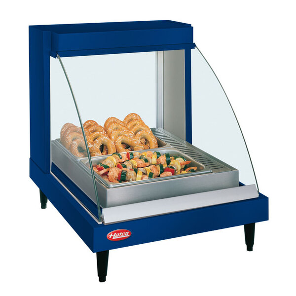 A Hatco navy blue countertop display case with food on a tray.