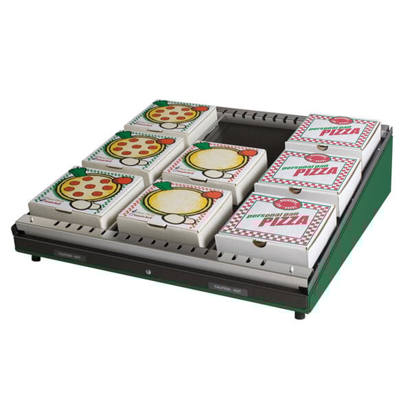 A Hatco Hunter Green pizza warmer with a stack of pizza boxes inside.