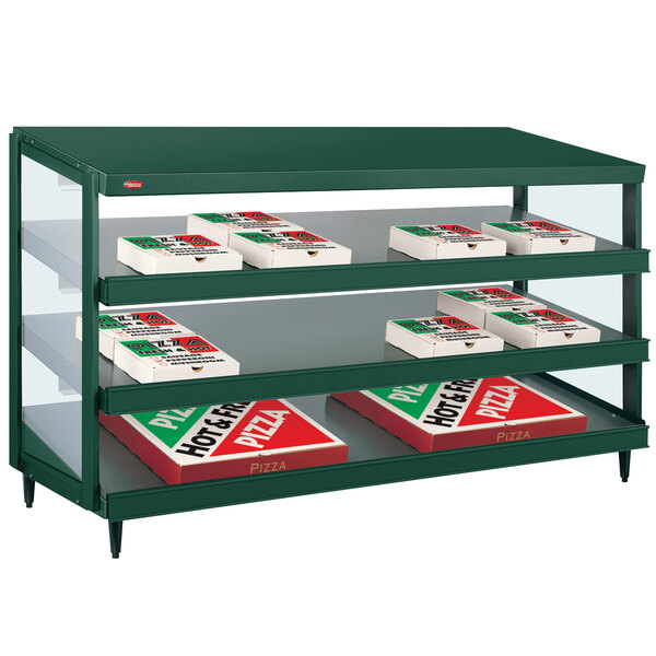 A Hunter Green Hatco countertop pizza warmer with shelves of pizza boxes inside.
