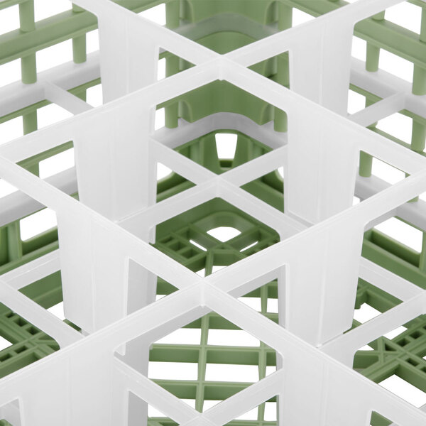 A white and green plastic Vollrath 9-compartment glass rack.