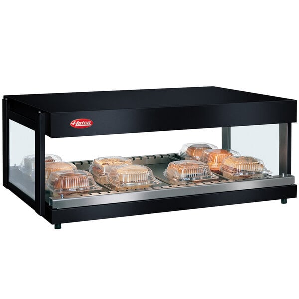 A black Hatco countertop food warmer with bread on a shelf.