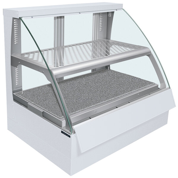 A white Hatco Flav-R-Savor food display case with a curved glass front on a countertop.