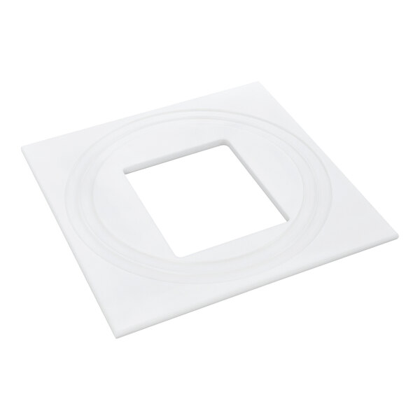 A white, square board with a centered square cutout and circular grooves around the opening.