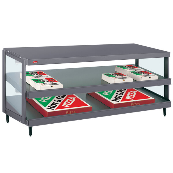 A grey Hatco countertop warmer shelf with pizza boxes on it.