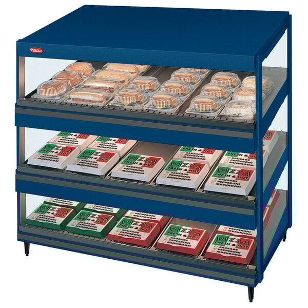 A navy blue Hatco countertop display case with food on shelves.
