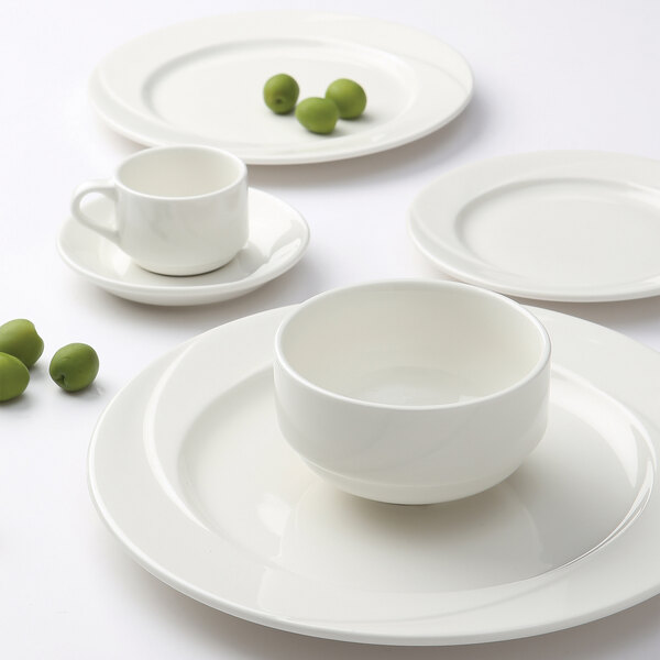A group of white Tuxton AlumaTux china plates.