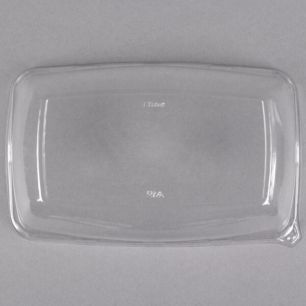 A clear plastic Sabert catering tray with a high dome lid.