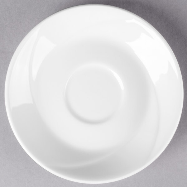 A Tuxton San Marino AlumaTux Pearl White saucer with a circular rim.