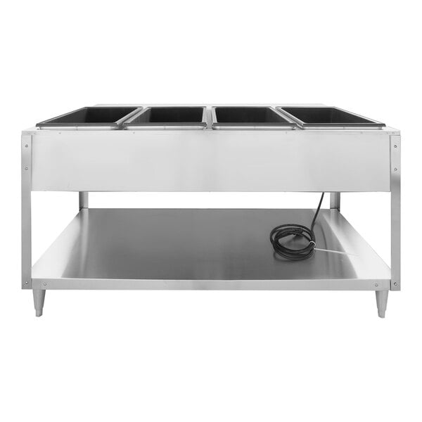 A stainless steel electric four pan hot food table with a lower shelf and a power cord.