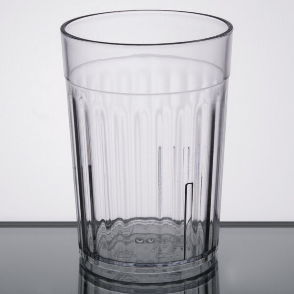 A clear Carlisle plastic tumbler.