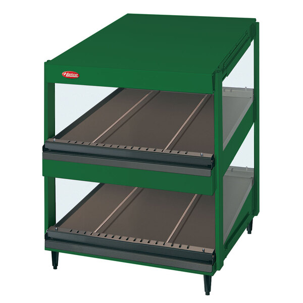 A green Hatco display case with glass shelves on two levels.