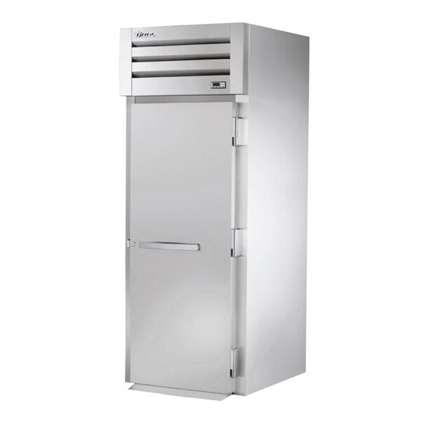 A white True roll-in heated holding cabinet with a solid door.