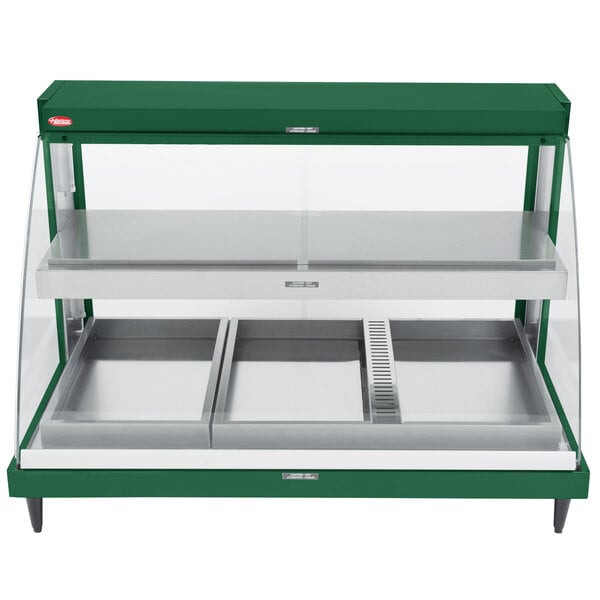 A green Hatco countertop food warmer with glass doors.