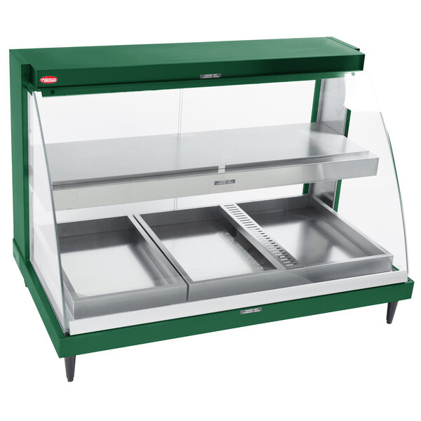 A green Hatco countertop display case with two shelves.
