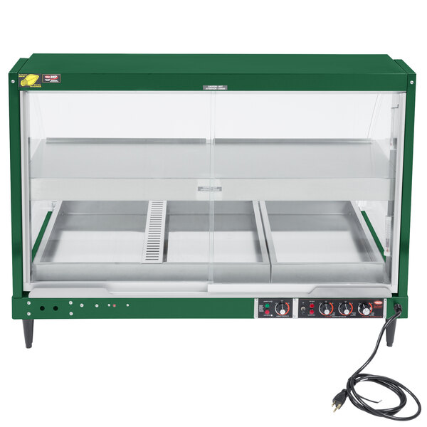 A green Hatco countertop food warmer with glass doors.