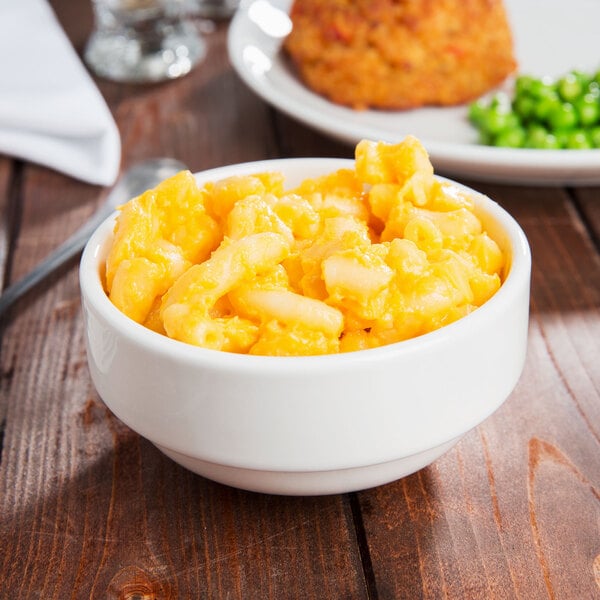 A bowl of macaroni and cheese in a Tuxton AlumaTux Pearl White china bowl.