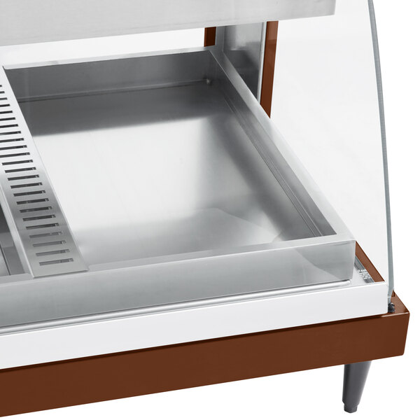 A Hatco countertop display warmer with glass shelves inside.
