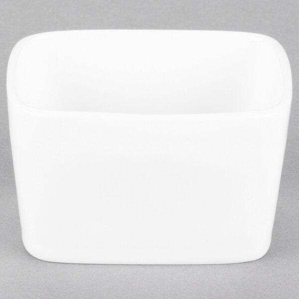 A Tuxton AlumaTux Pearl White china sugar packet holder.