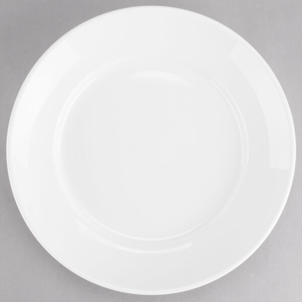 A Tuxton AlumaTux Pearl White bowl with a circular edge.