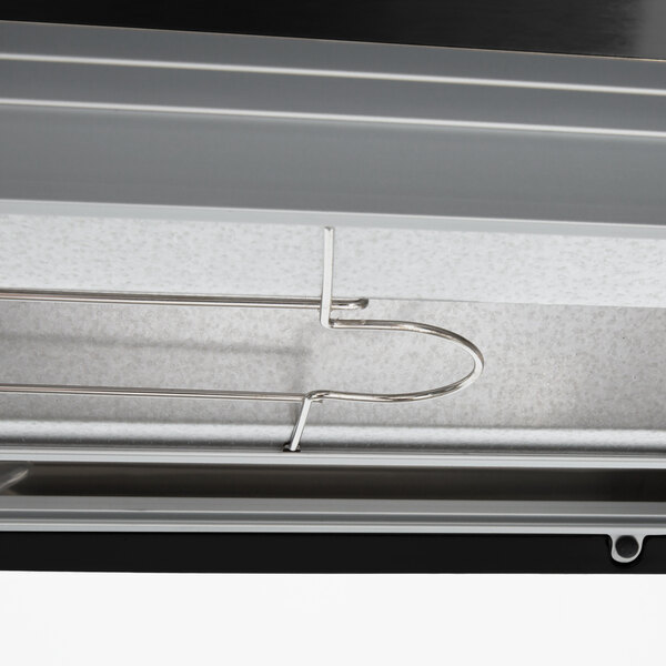 A close up of the metal shelves inside a Hatco Glo-Ray countertop warmer.