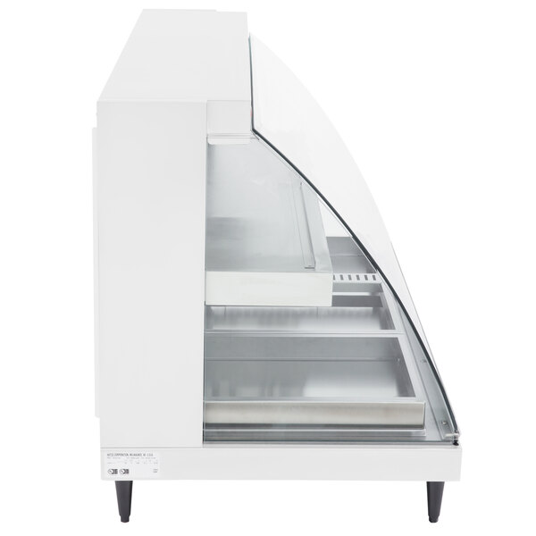 A white Hatco countertop merchandiser with glass shelves and doors.