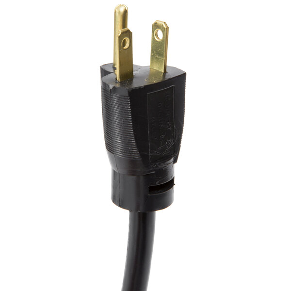 A black power cord with a gold plug on a Hatco countertop warmer.