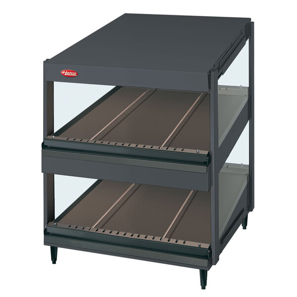 A black Hatco countertop display case with two slanted glass shelves.