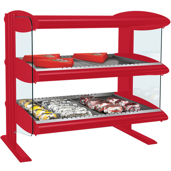 A red Hatco countertop food display with two glass shelves.