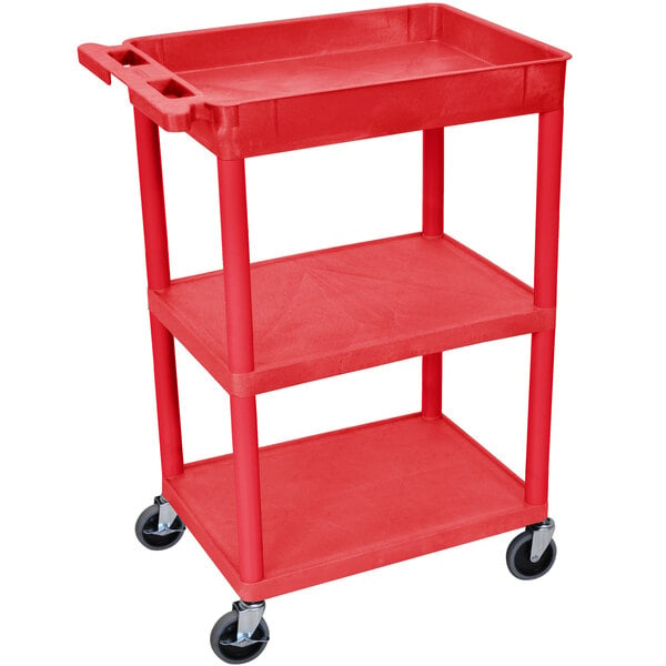 A red Luxor plastic utility cart with three shelves and wheels.