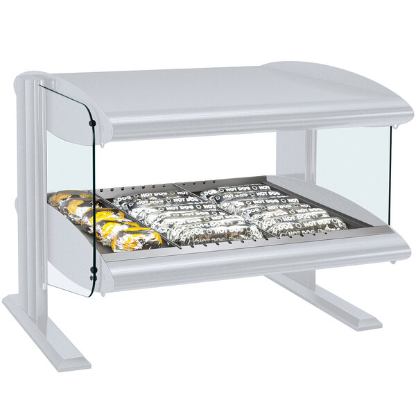 A white Hatco countertop display shelf with food in a glass case.