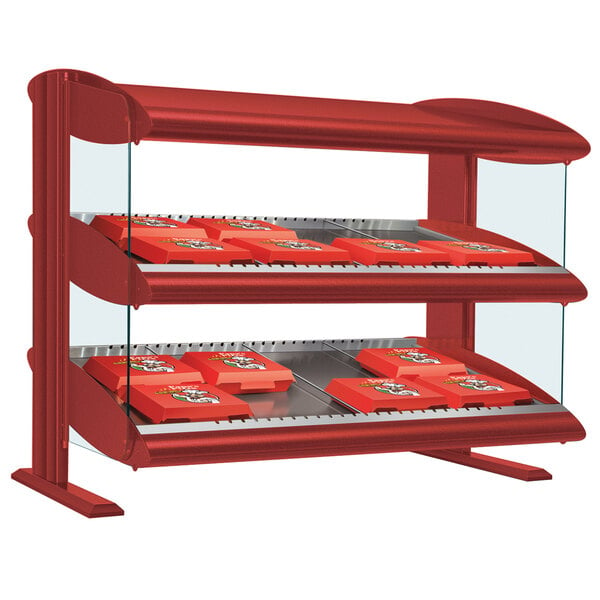 A red Hatco warm LED countertop display case with shelves holding food.