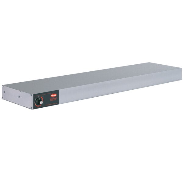 A white rectangular metal shelf with a red light on it.