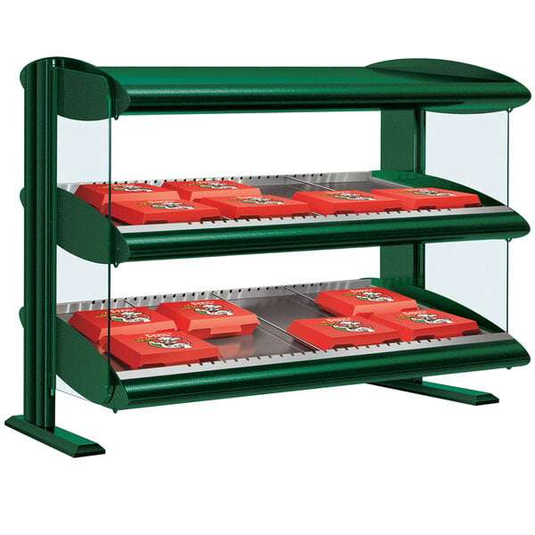 A Hunter Green Hatco horizontal shelf merchandiser with orange trays in a bakery display.