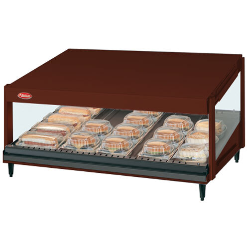 An Antique Copper Hatco countertop food warmer with a slanted shelf of food.