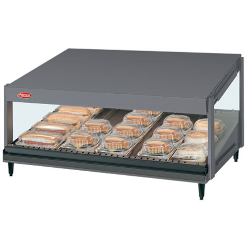A Hatco countertop hot food display warmer with a slanted shelf of food.